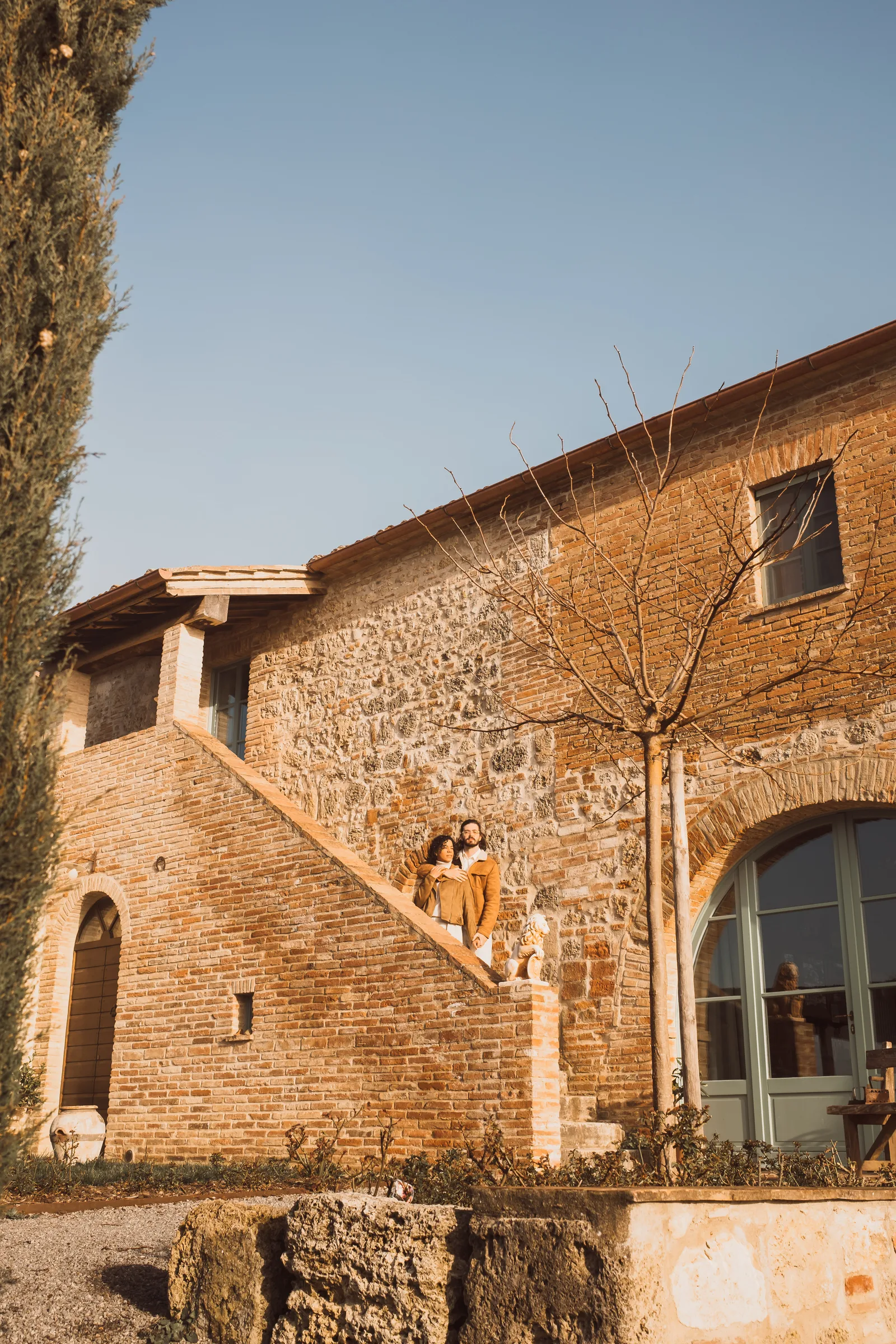Stone farmhouse among cypress trees in Tuscany